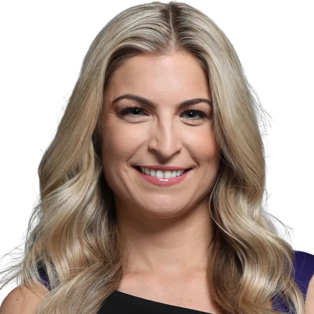 A woman with blonde hair and a black top.